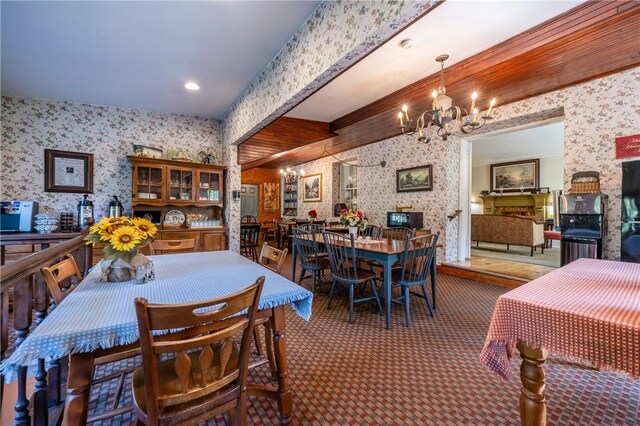 948 George St, Wheatland, NY 14511 - dining area with wallpapered walls, a chandelier, and carpet flooring