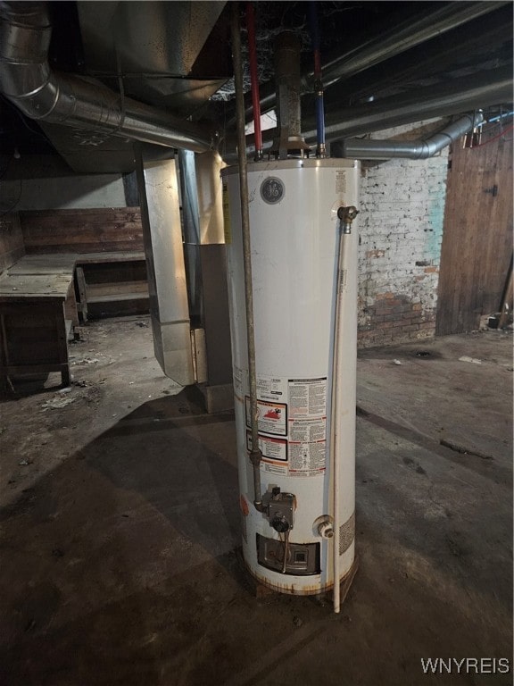 utility room with gas water heater