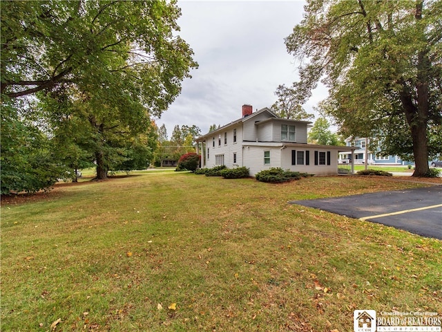 view of property exterior featuring a yard