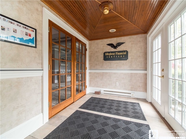 unfurnished sunroom featuring french doors, a wealth of natural light, and wooden ceiling