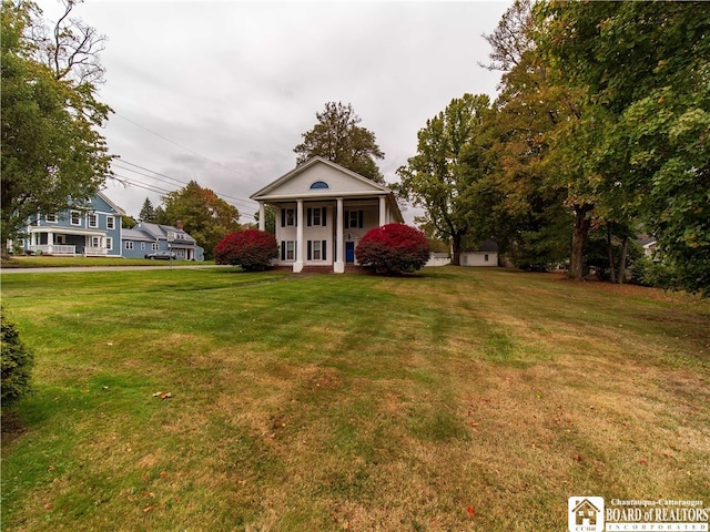 exterior space with a front lawn and covered porch