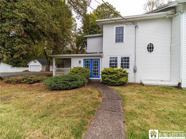 view of front of property featuring a garage and a front lawn