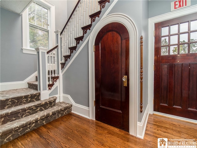 foyer entrance with hardwood / wood-style floors