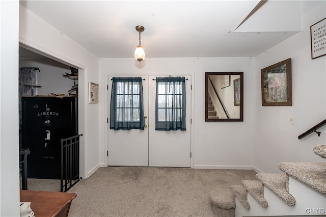 carpeted entryway with french doors