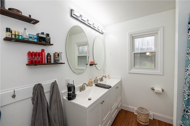 bathroom featuring hardwood / wood-style flooring and vanity