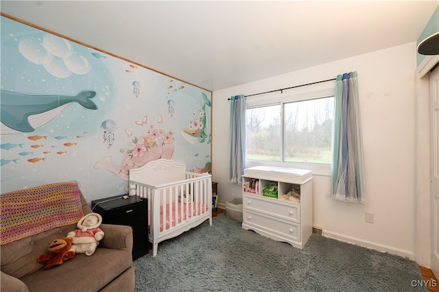 bedroom featuring carpet flooring and a nursery area