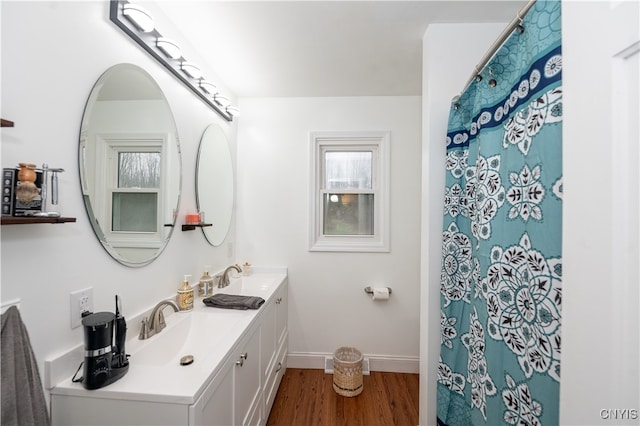 bathroom with hardwood / wood-style flooring and vanity