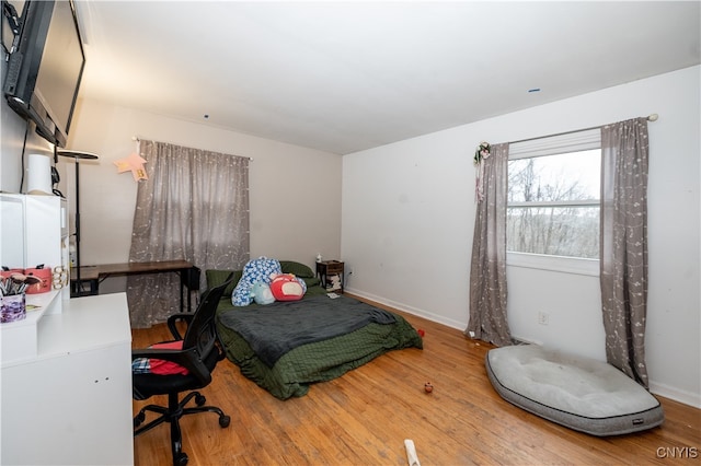 bedroom featuring wood-type flooring