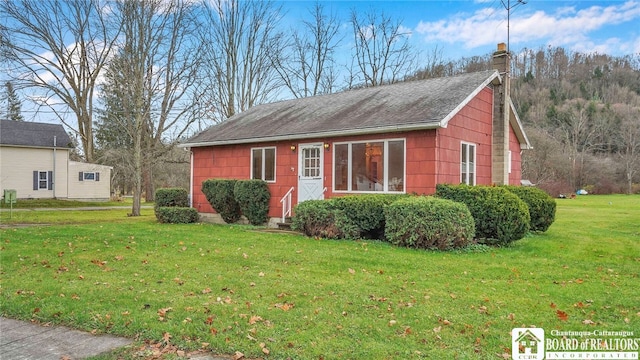 view of property exterior with a lawn