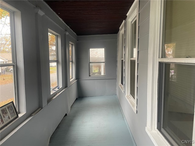 sunroom / solarium with wood ceiling and plenty of natural light