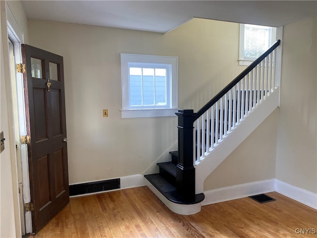 entryway with wood-type flooring