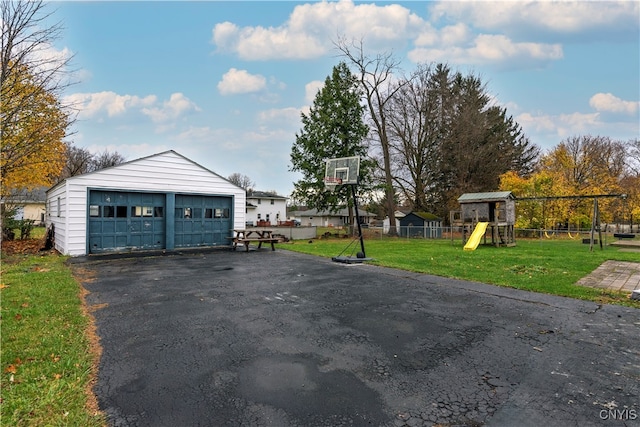 garage featuring a lawn