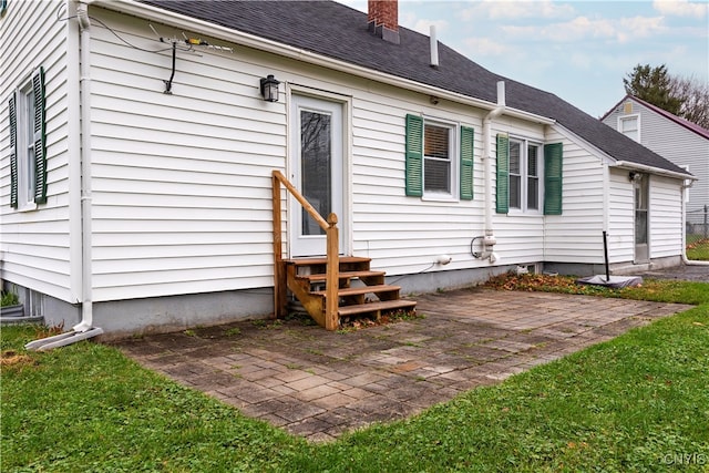 rear view of property featuring a patio