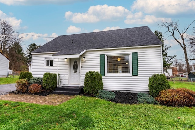 bungalow with a front lawn