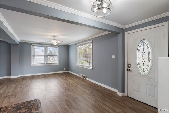 entrance foyer with plenty of natural light, ceiling fan, crown molding, and dark hardwood / wood-style flooring