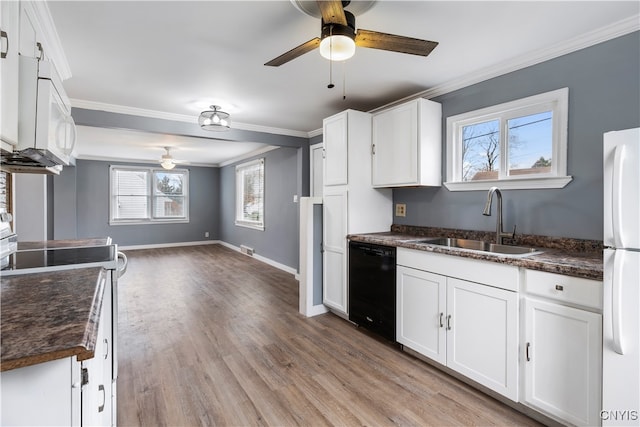 kitchen featuring light hardwood / wood-style floors, sink, ornamental molding, white appliances, and white cabinets