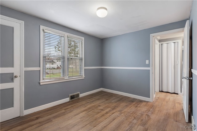 spare room featuring light hardwood / wood-style floors