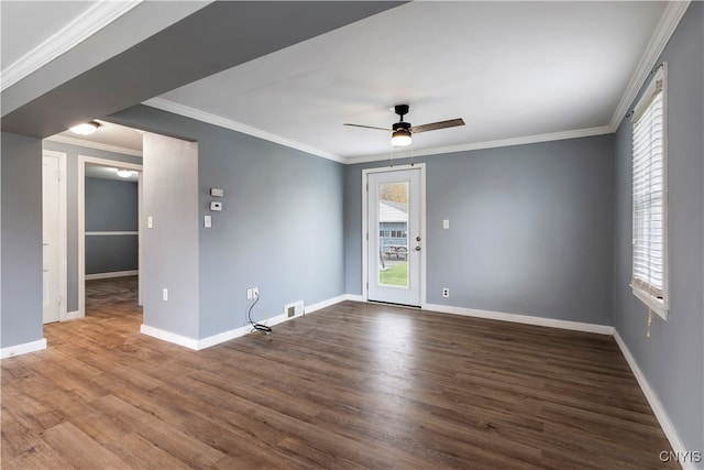 empty room with wood-type flooring, ceiling fan, and crown molding