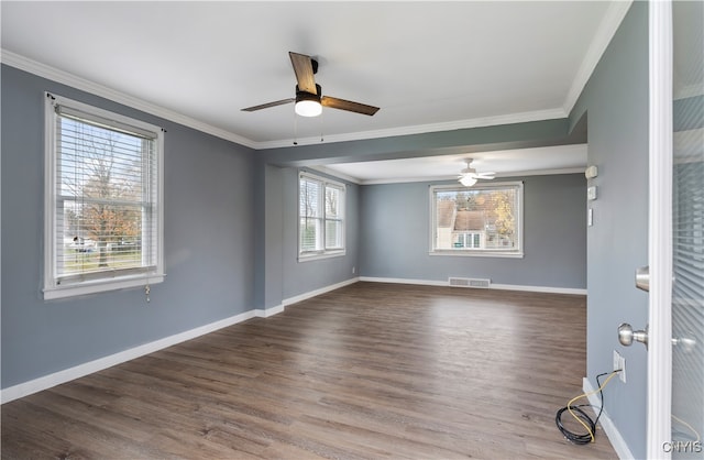 spare room with wood-type flooring, ceiling fan, and crown molding