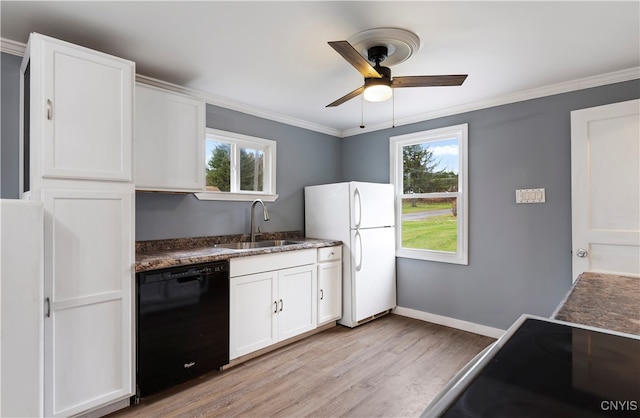 kitchen with a wealth of natural light, sink, white refrigerator, and dishwasher