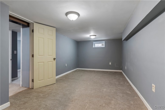 basement featuring light colored carpet