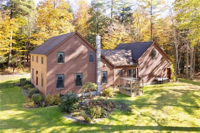171 Oak Tree Ln, Bainbridge, NY 13733 - rear view of house with a lawn, fence, a vegetable garden, and a chimney