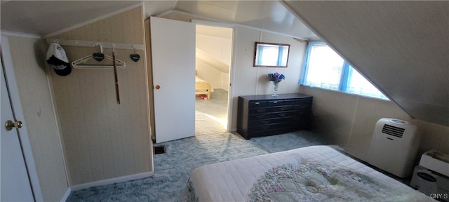 bedroom with lofted ceiling and light carpet