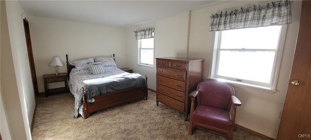 bedroom featuring light carpet