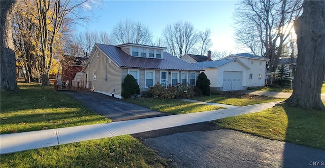 view of front facade with a garage and a front lawn