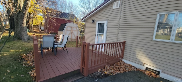 deck featuring a shed