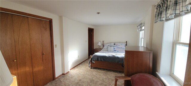 carpeted bedroom with a closet