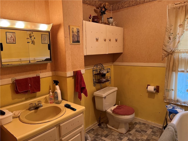 bathroom with toilet and vanity