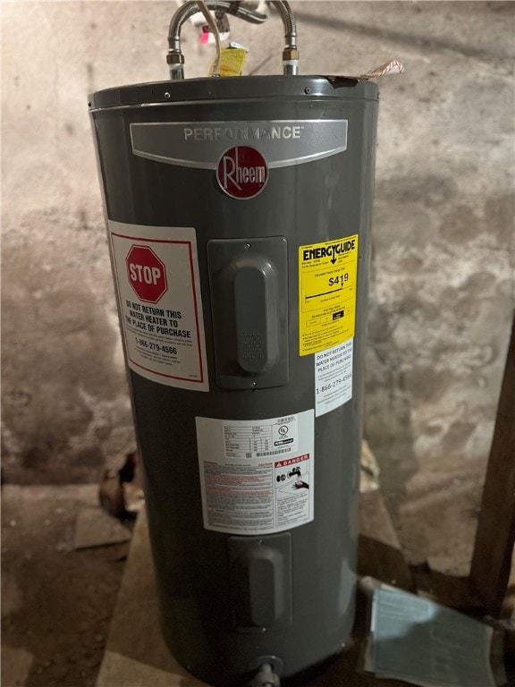 utility room featuring electric water heater