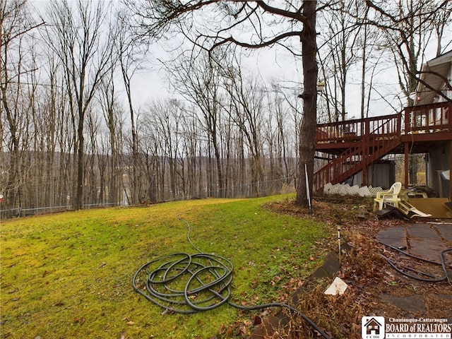 view of yard with a wooden deck