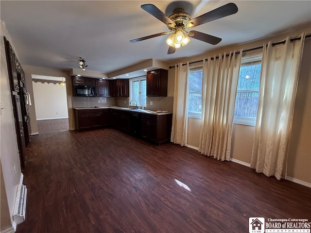 kitchen with dark wood-type flooring, backsplash, dark brown cabinetry, and ceiling fan