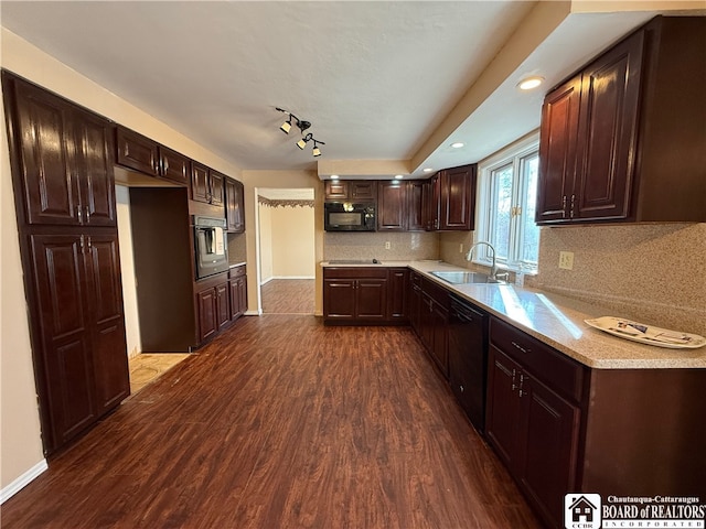 kitchen with black appliances, sink, tasteful backsplash, and dark wood-type flooring