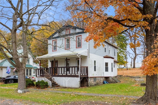 view of front of home featuring a porch and a front yard