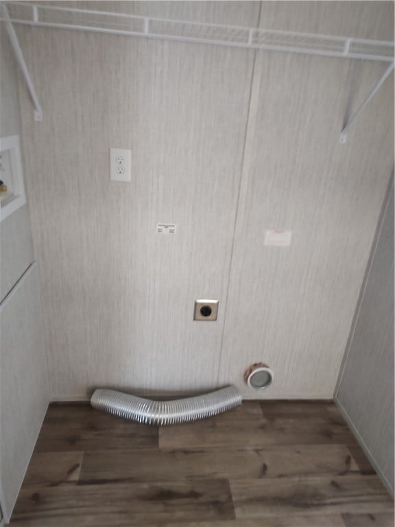 washroom with hardwood / wood-style flooring, hookup for an electric dryer, and washer hookup