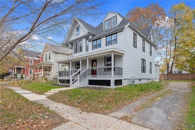 view of front of home featuring a porch and a front lawn