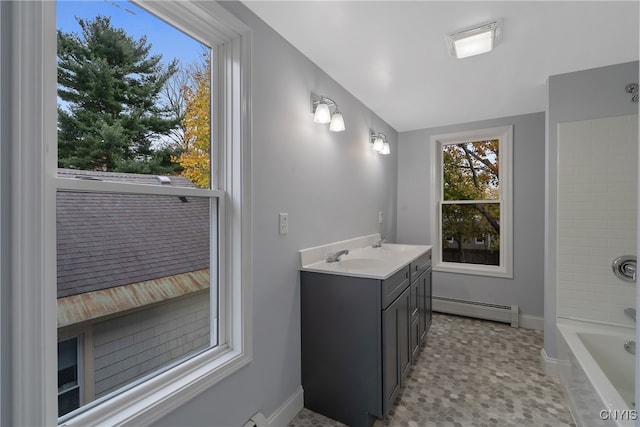 bathroom with vanity, lofted ceiling, shower / bathtub combination, and a baseboard radiator