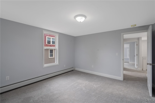 carpeted empty room with baseboard heating