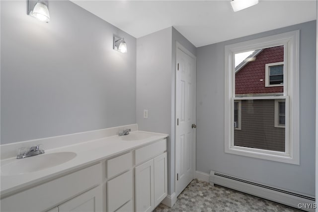 bathroom featuring vanity, tile patterned floors, and a baseboard radiator