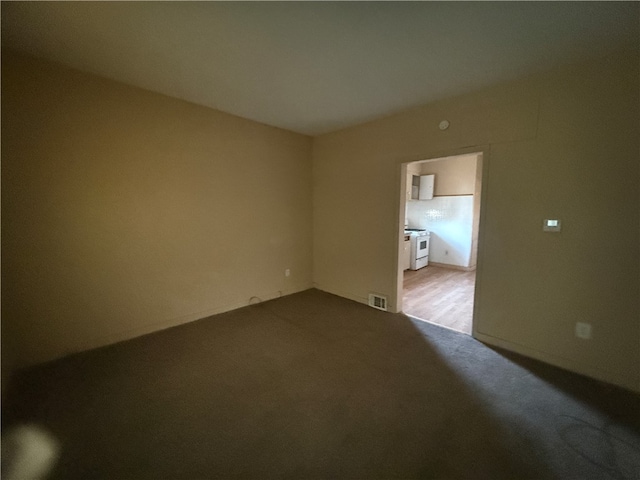 spare room with light colored carpet