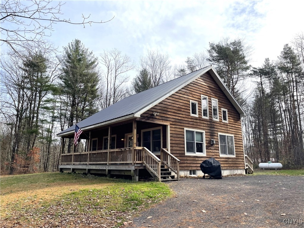 74 Kasoag Lake Rd, Williamstown, NY 13302 - cabin featuring covered porch