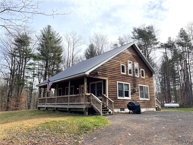 cabin featuring covered porch