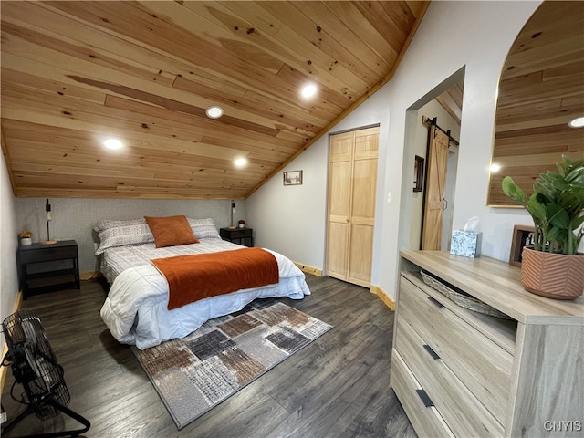 bedroom with dark wood-type flooring, wood ceiling, a barn door, and vaulted ceiling