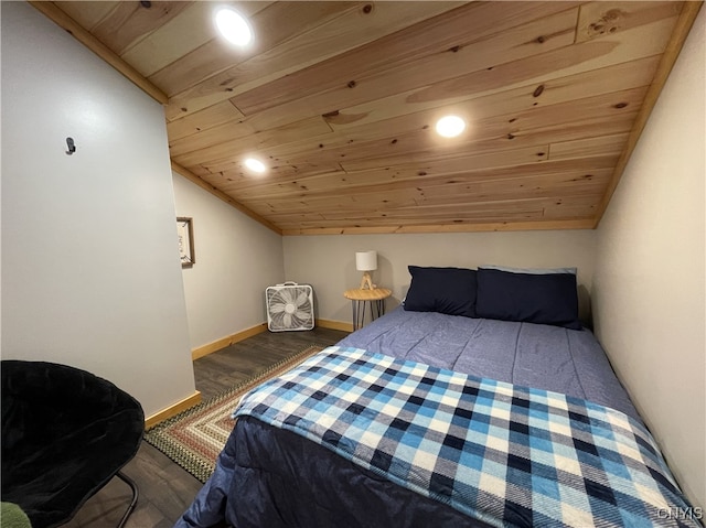 bedroom with dark hardwood / wood-style flooring, wood ceiling, and lofted ceiling