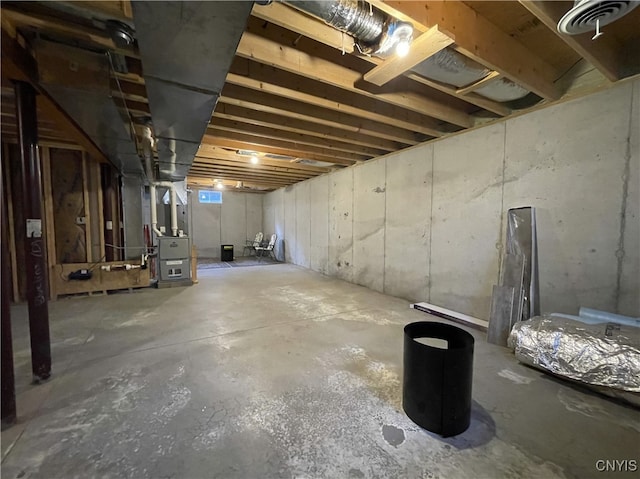 basement featuring heating unit