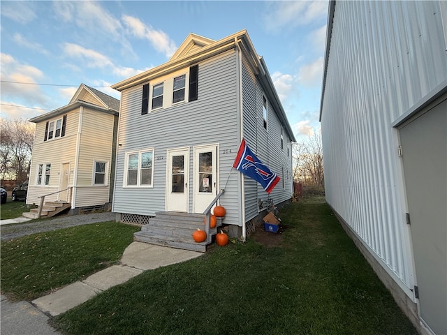 view of front of home with a front lawn