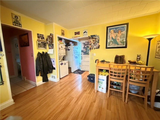 office area featuring ornamental molding and light hardwood / wood-style flooring